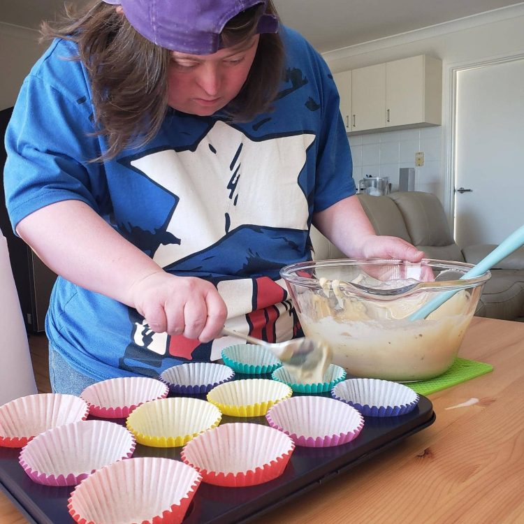 Lady Baking Cupcakes with support of Allied Health Services Perth